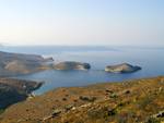 Panormos bay on Tinos guarded by Planitis island